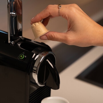 Insert your Nespresso Home Compostable Original capsule into your Original coffee machine