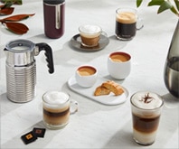 Nespresso, REVEAL design glass espresso cups, coffee bags on foot. Set of  4. Marked. Discontinued item.